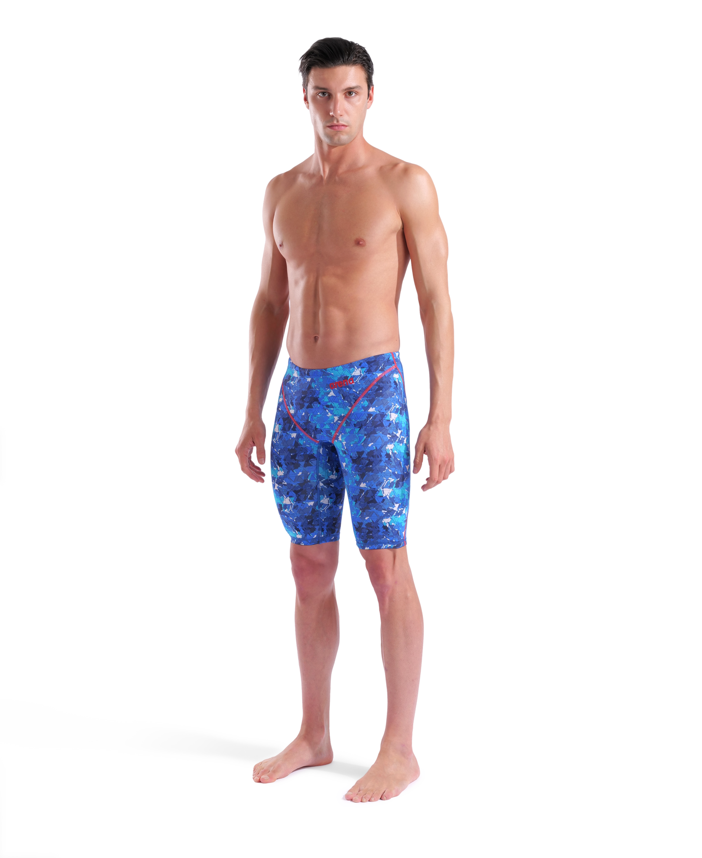A man stands barefoot against a white background, wearing Arena Men's Powerskin ST Next Jammer - Limited Edition - Splashy swimwear, and looking directly at the camera.