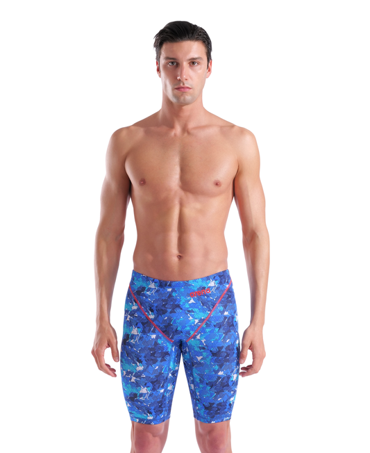 A man with short dark hair stands against a white background, wearing the Arena Men's Powerskin ST Next Jammer - Limited Edition - Splashy by Arena. He faces forward with a neutral expression, arms at his sides.
