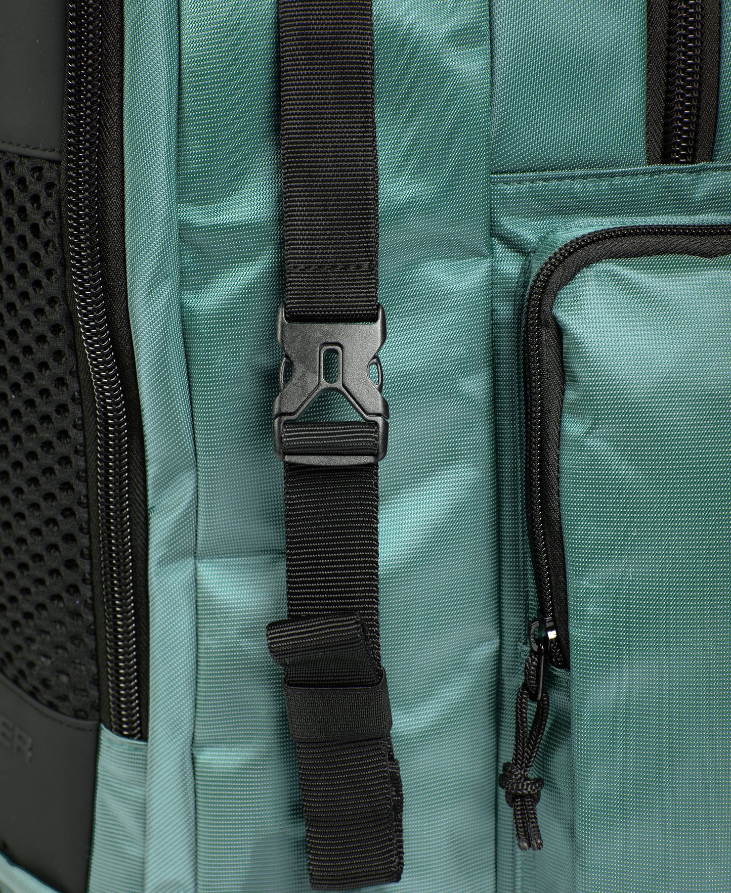Close-up of the Arena All Set Sports Swim Backpack 45L in Sage, featuring a black adjustable strap with plastic buckle, zippered pocket, mesh fabric on the left side, and an internal laptop sleeve for convenience.